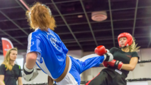 Two young women engage in a form of highly variable practice: sparring